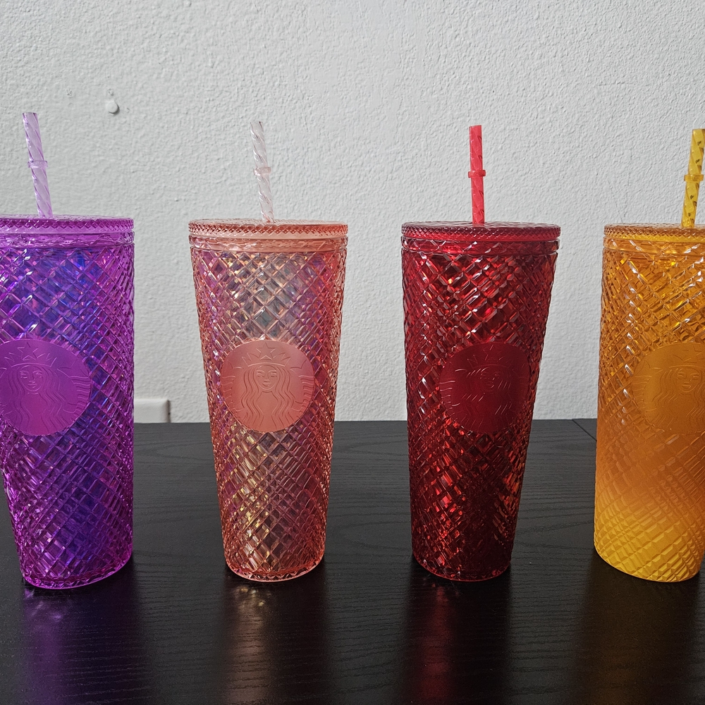Set of four Venti 24oz Starbucks Jeweled tumblers with matching straws.